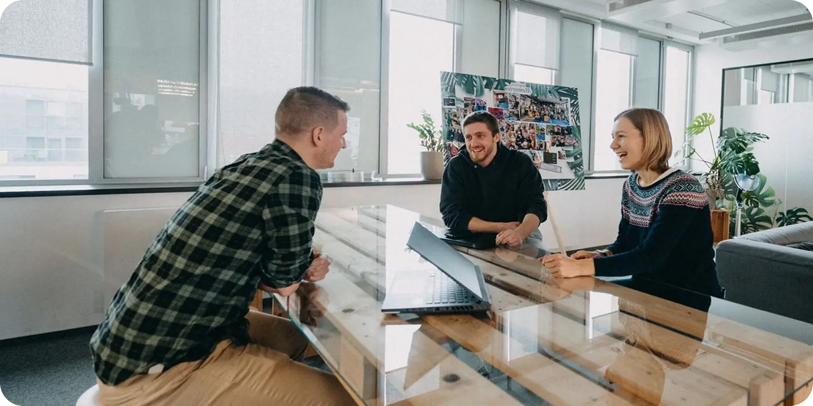 A sunlit workspace sets the stage as three colleagues gather around a handsome wooden table, laptops open and spirits high. With laughter and lively conversation, they chat about the smart, streamlined solutions ShipMonk brings to their growing business. Lush indoor plants and expansive windows make it easy to feel inspired—and just plain happy to be here. It’s teamwork at its best: practical, positive, and powered by ShipMonk.com. Now that’s a good thing—don’t you think?. via ShipMonk.com