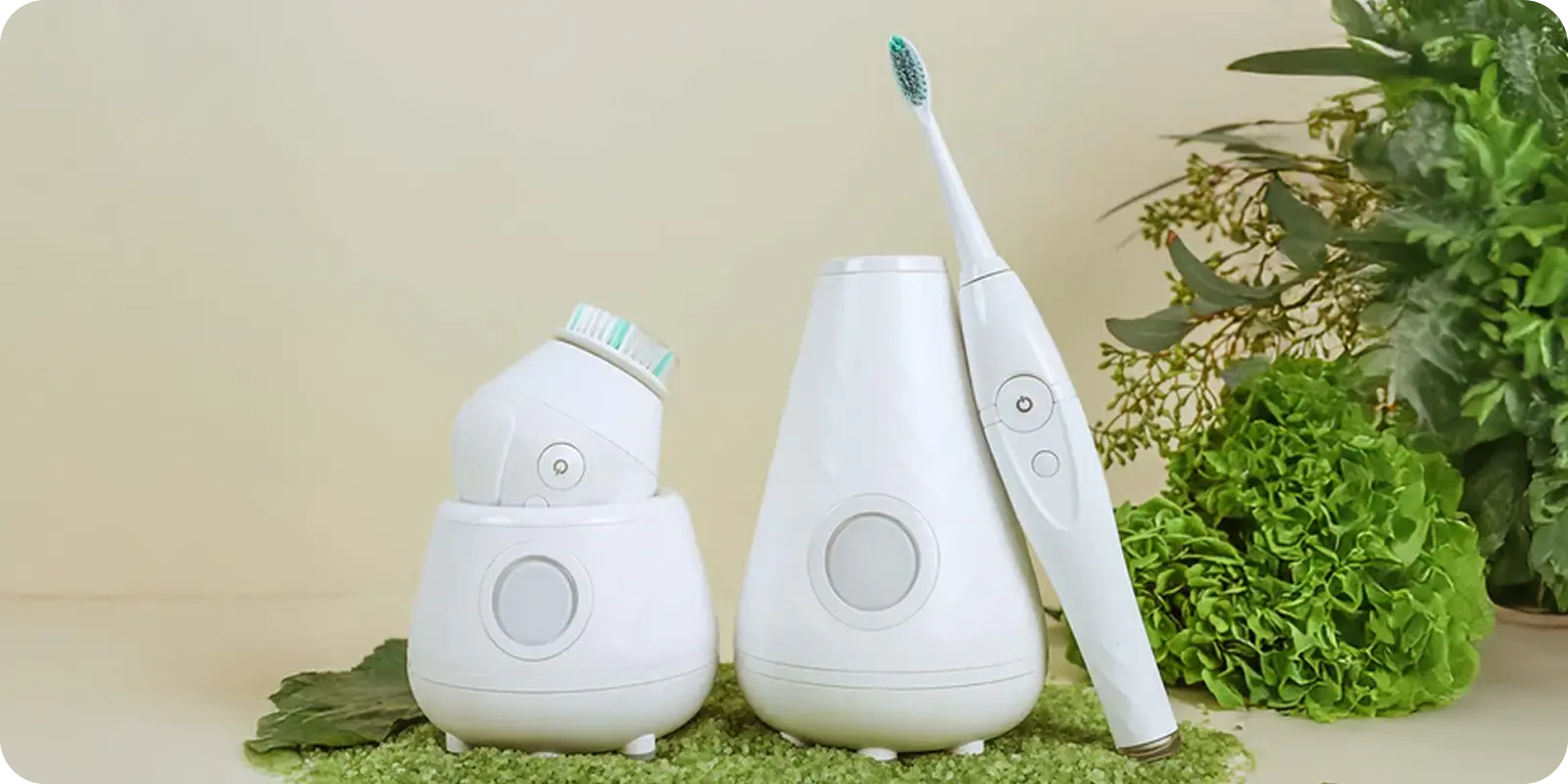 Three sleek white care gadgets nestle on leafy moss—fresh, neat, and ready to ship smoothly with ShipMonk.com. via ShipMonk.com
