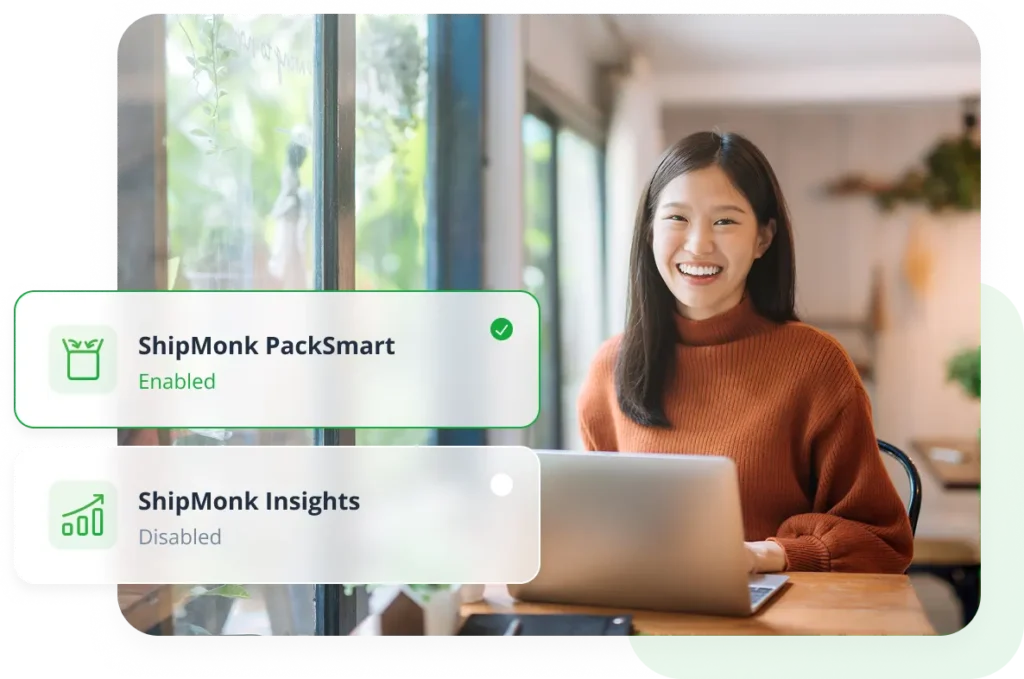 A cheerful woman at her desk, tools nearby, laptop open—ShipMonk.com’s PackSmart shines; Insights is paused for now. via ShipMonk.com