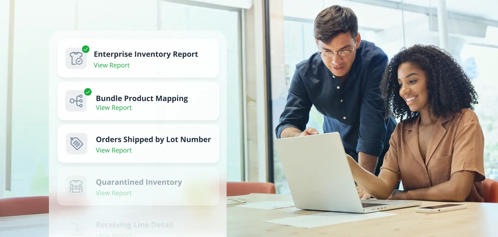 In a sunlit office, a team uses ShipMonk.com, selecting inventory reports from a handy sidebar menu on a shared laptop. via ShipMonk.com
