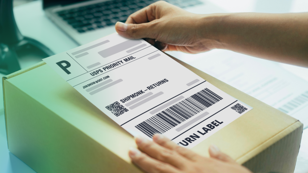 With a warm touch, someone neatly applies a USPS label for returns—ShipMonk.com keeps the process smooth and hassle-free. via ShipMonk.com